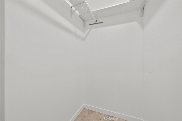 walk in closet featuring light wood-style flooring