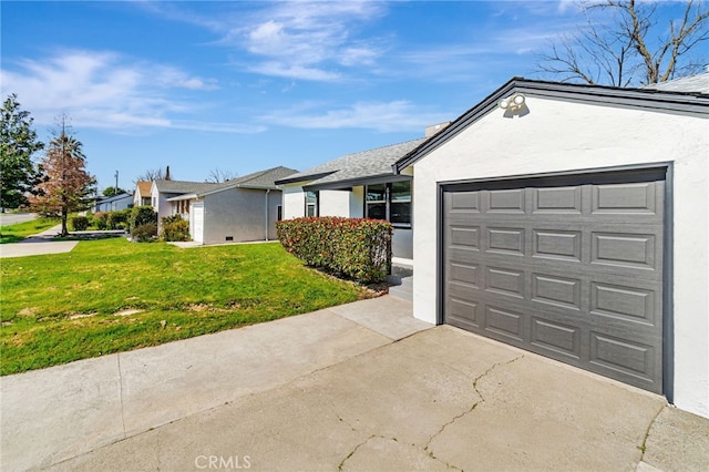 ranch-style home featuring a garage, stucco siding, concrete driveway, and a front yard