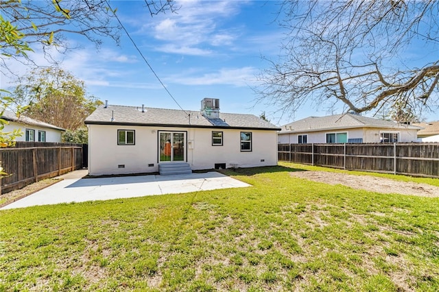 back of house featuring a patio, a fenced backyard, entry steps, crawl space, and a lawn