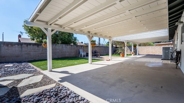 view of patio with a fenced backyard and central AC