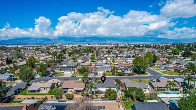 birds eye view of property featuring a mountain view and a residential view