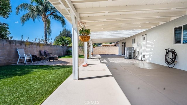 view of patio / terrace featuring a fire pit and a fenced backyard