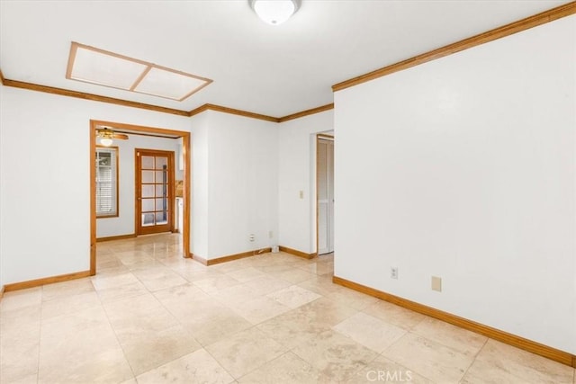 unfurnished room featuring baseboards and crown molding