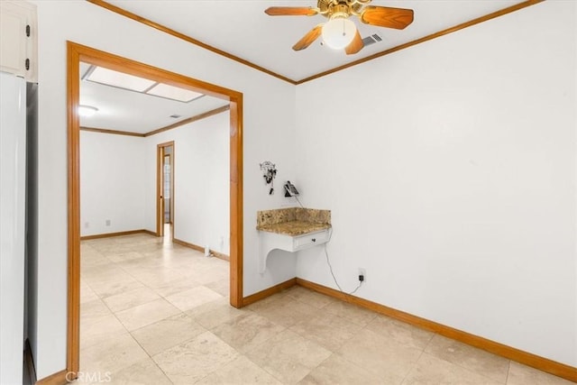 unfurnished room with ceiling fan, visible vents, baseboards, and ornamental molding