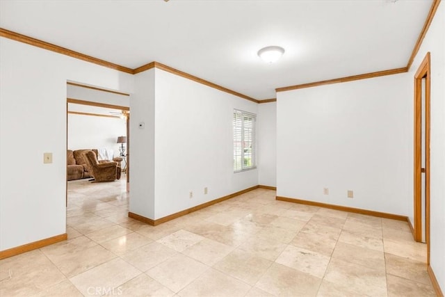 unfurnished room featuring crown molding and baseboards