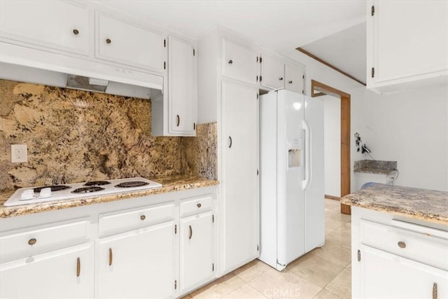 kitchen with white cabinetry, white appliances, light tile patterned flooring, and tasteful backsplash