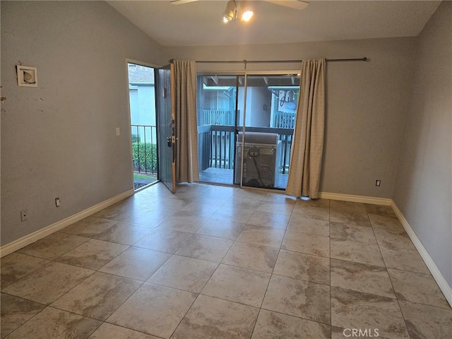 unfurnished room with tile patterned floors, baseboards, lofted ceiling, and a ceiling fan