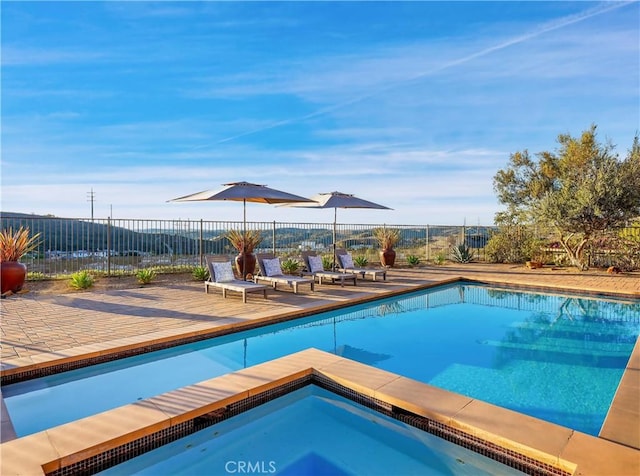 view of pool featuring a patio area, a fenced in pool, and fence