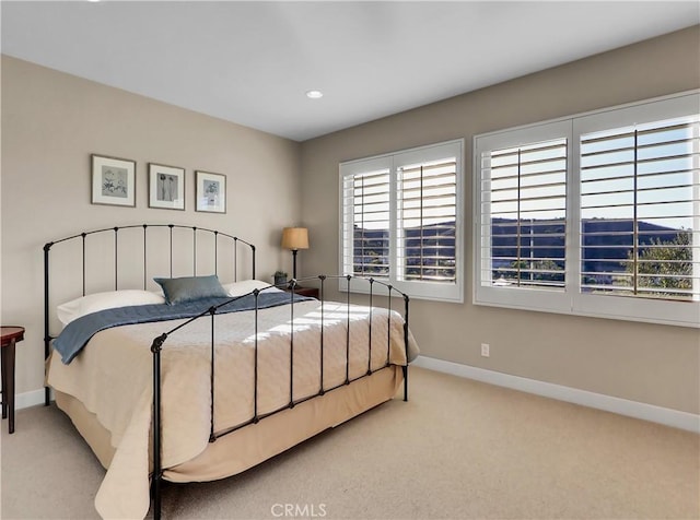 carpeted bedroom with recessed lighting and baseboards