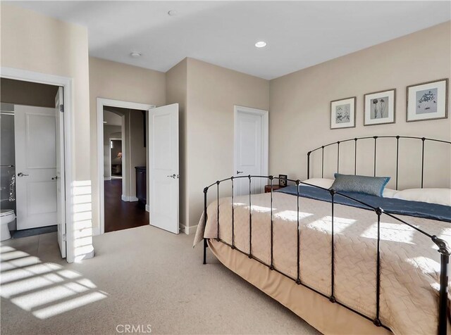 bedroom with baseboards, recessed lighting, and carpet