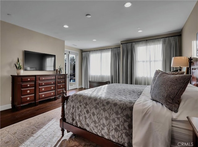 bedroom featuring access to exterior, recessed lighting, dark wood-style floors, and baseboards