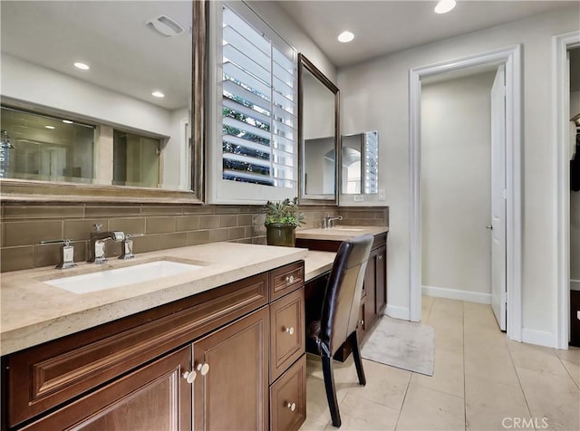 bathroom with baseboards, decorative backsplash, recessed lighting, tile patterned floors, and vanity