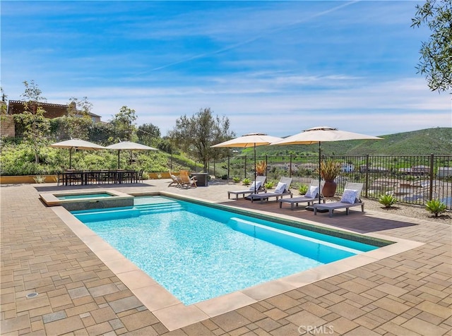31801 Via Granada, San Juan Capistrano, CA 92675 - view of pool with a patio area, outdoor dining space, and a pool with connected hot tub