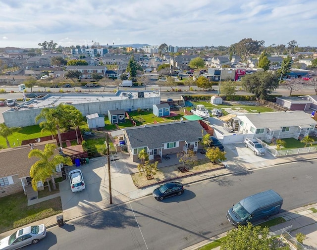 birds eye view of property with a residential view