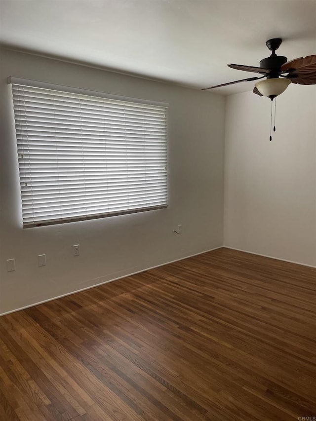 unfurnished room with a ceiling fan and wood finished floors