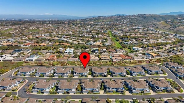 birds eye view of property with a mountain view and a residential view