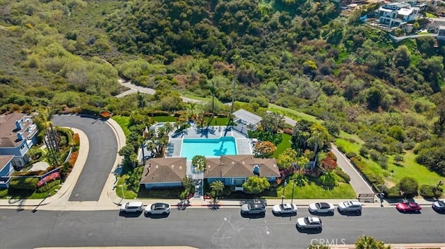 bird's eye view featuring a wooded view