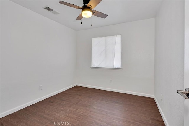 unfurnished room featuring visible vents, ceiling fan, baseboards, and wood finished floors