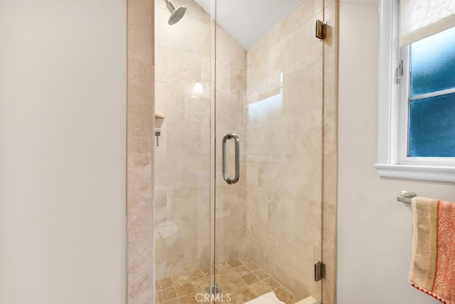 full bath featuring a stall shower and lofted ceiling