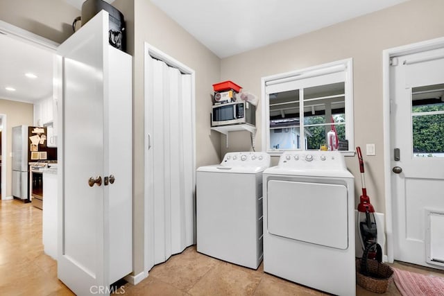 laundry area featuring laundry area, recessed lighting, and separate washer and dryer