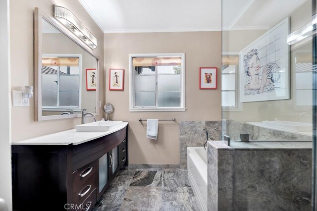 full bath with marble finish floor, vanity, a garden tub, and ornamental molding