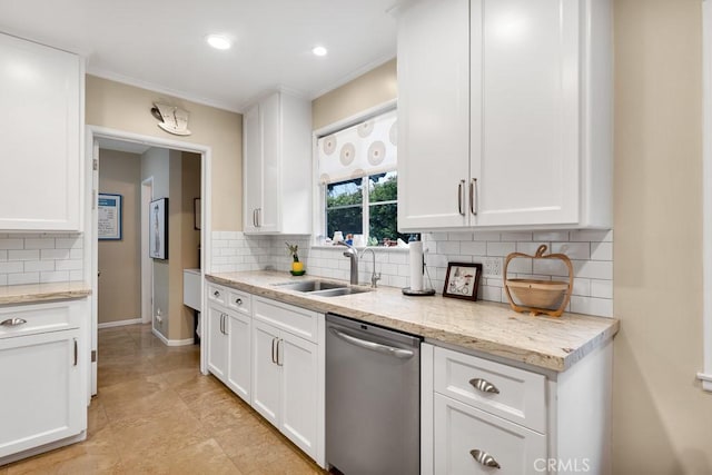 kitchen with a sink, backsplash, white cabinetry, and stainless steel dishwasher