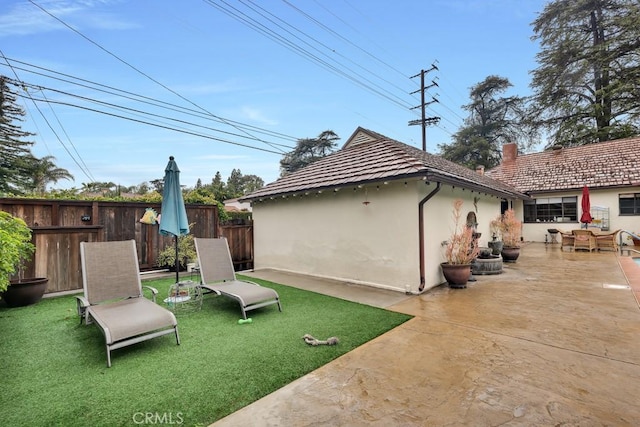 view of yard with a patio and fence