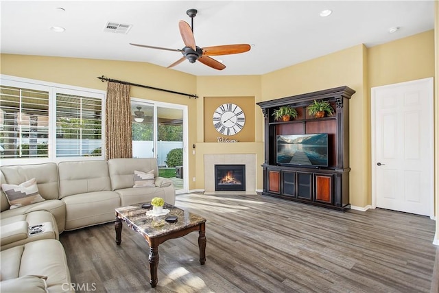 30283 Moon Star Cir, Menifee, CA 92584 - living area with ceiling fan, wood finished floors, vaulted ceiling, a fireplace, and recessed lighting