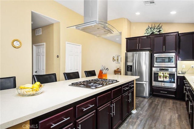 kitchen with island exhaust hood, light countertops, visible vents, and stainless steel appliances