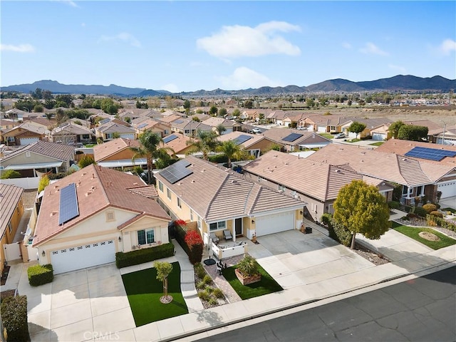 aerial view featuring a mountain view and a residential view