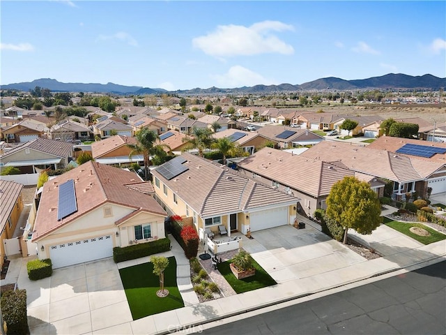 drone / aerial view with a mountain view and a residential view