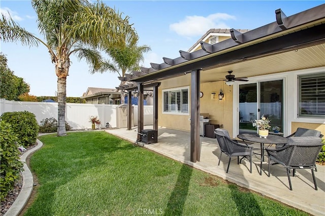 view of yard with a patio, a ceiling fan, and fence