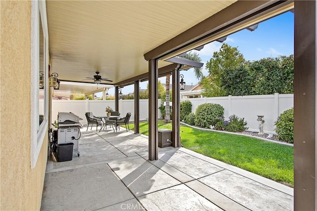 view of patio with a grill, outdoor dining area, and a fenced backyard