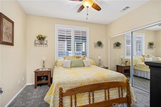 bedroom featuring ceiling fan, a closet, visible vents, carpet floors, and baseboards