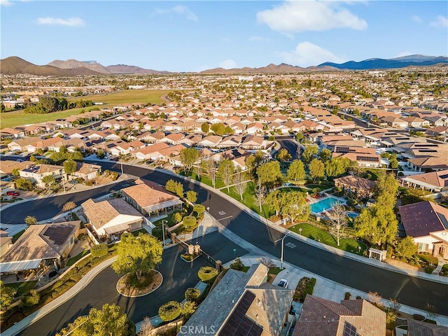 birds eye view of property with a mountain view and a residential view