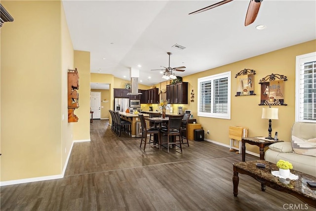 dining space featuring visible vents, dark wood-type flooring, recessed lighting, ceiling fan, and vaulted ceiling