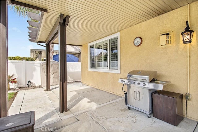 view of patio / terrace featuring fence and grilling area