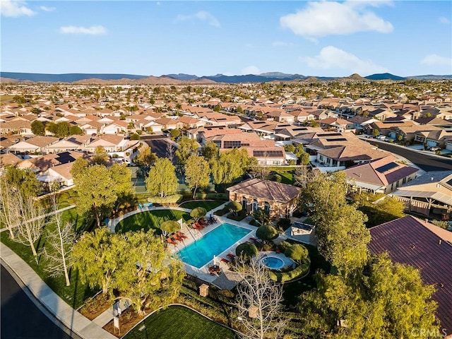 birds eye view of property with a mountain view and a residential view