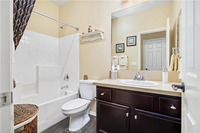 full bathroom with vanity, wood finished floors, toilet, and shower / bathtub combination with curtain