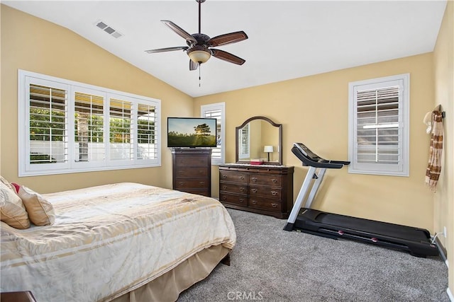 bedroom featuring visible vents, carpet flooring, lofted ceiling, and ceiling fan