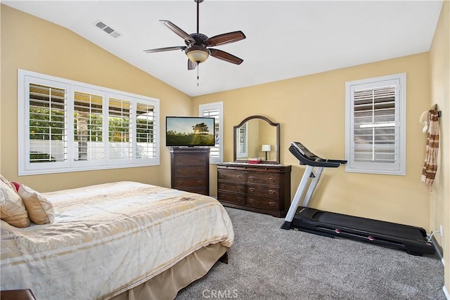 bedroom with visible vents, baseboards, ceiling fan, carpet floors, and vaulted ceiling