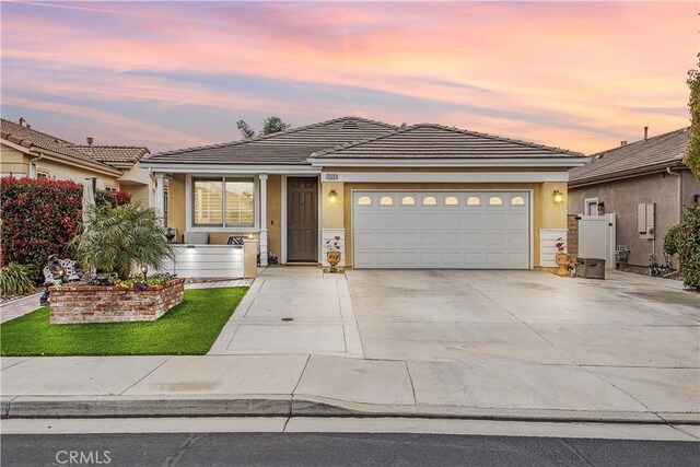30283 Moon Star Cir, Menifee, CA 92584 - ranch-style home featuring driveway, an attached garage, stucco siding, and a tiled roof