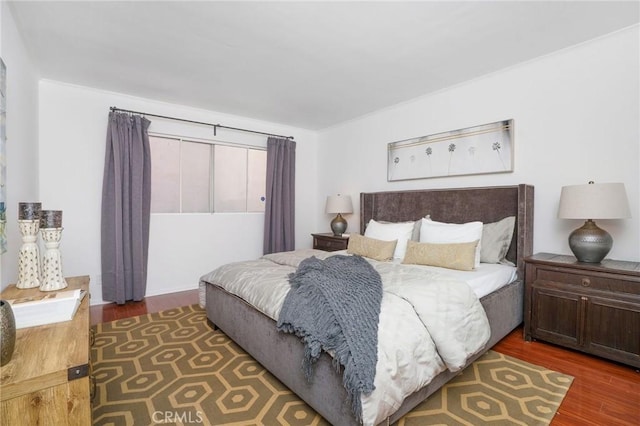 bedroom featuring wood finished floors