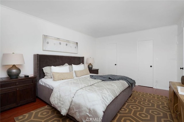 bedroom with wood finished floors