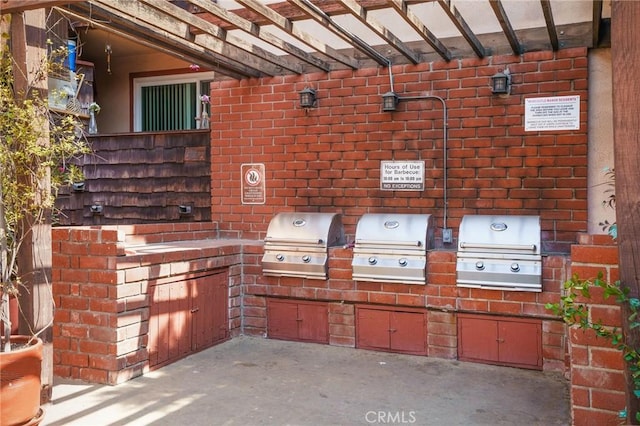 view of patio / terrace with area for grilling and a grill