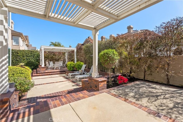 view of patio / terrace featuring outdoor dining space, a pergola, and fence