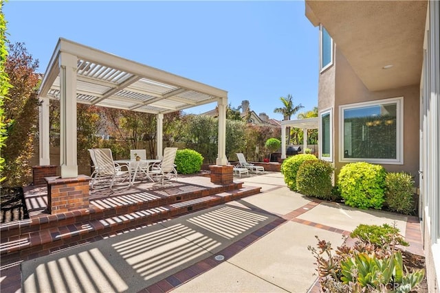 view of patio / terrace with outdoor dining space, fence, and a pergola