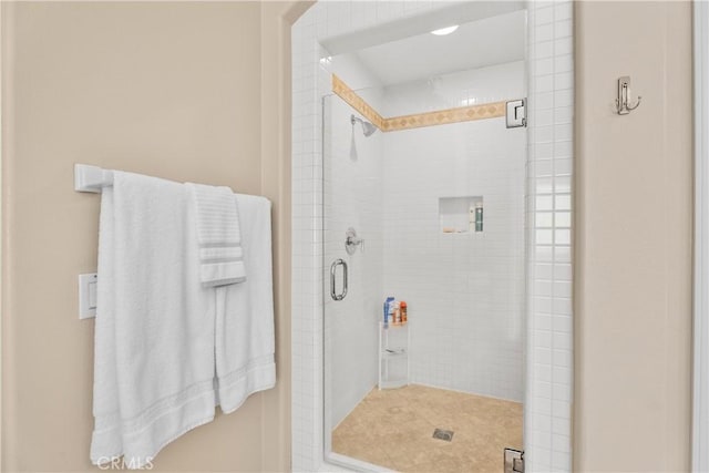 full bathroom featuring a stall shower