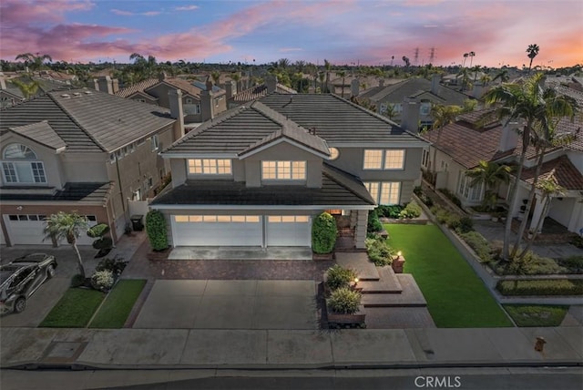 aerial view at dusk with a residential view