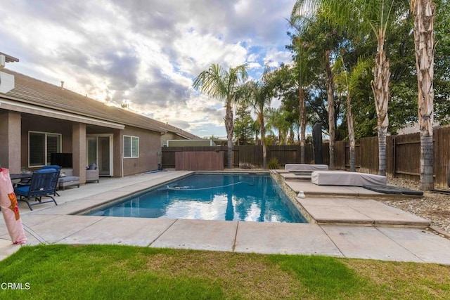 view of pool with a fenced in pool, a patio, and a fenced backyard